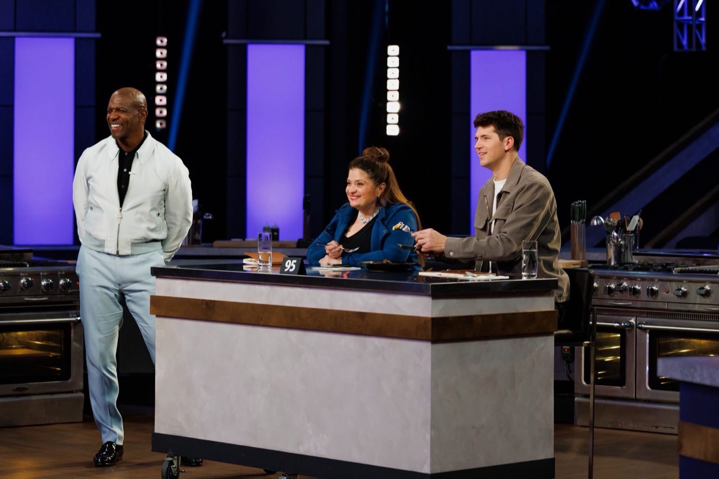 The 100 Cooks judges and host Terry Crews